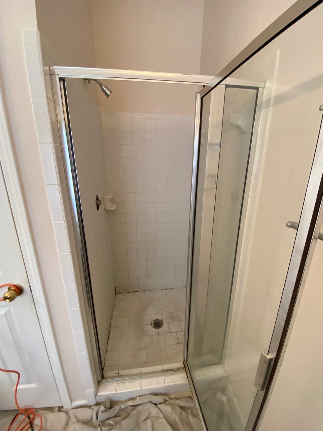 Dated shower stall before the renovation