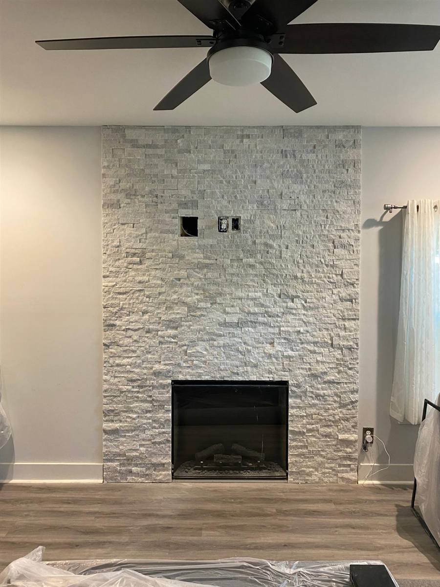 Stacked-stone tile fireplace surround