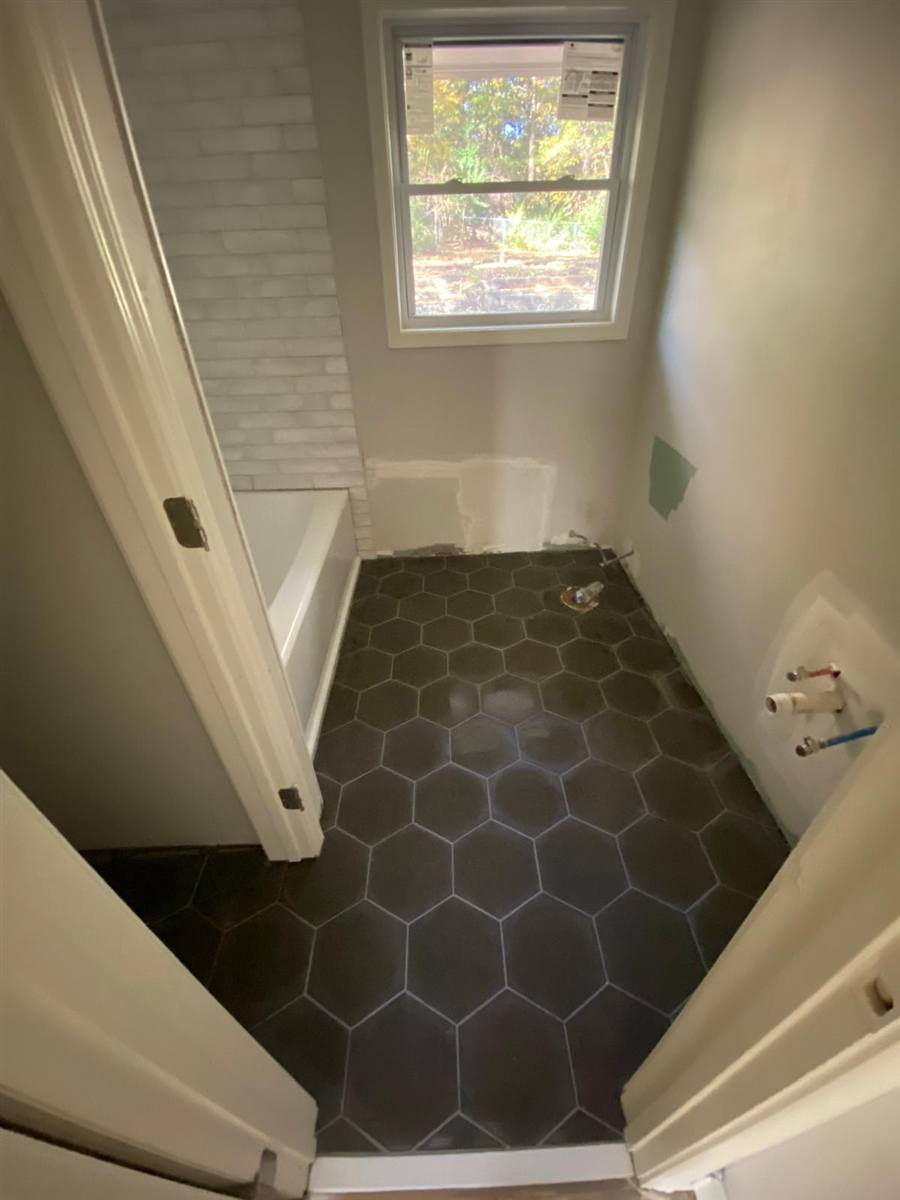 Black hexagon tile bathroom floor