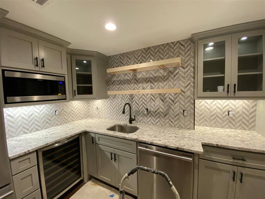 Herringbone tile kitchen backsplash